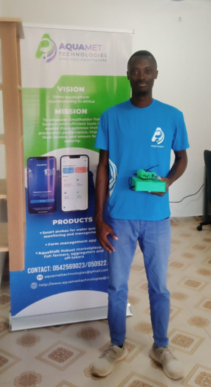 black man standing in front of a roll-up about Aquamet.